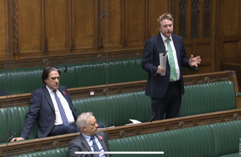 Mark Logan MP asks a question in the House of Commons Chamber