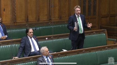 Mark Logan MP asks a question in the House of Commons Chamber